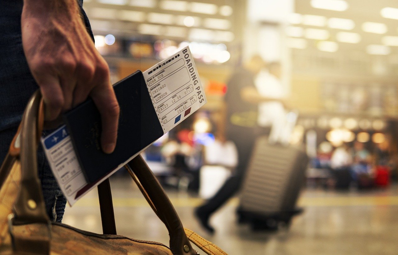 Traveler planning award flight bookings with credit cards and passport.