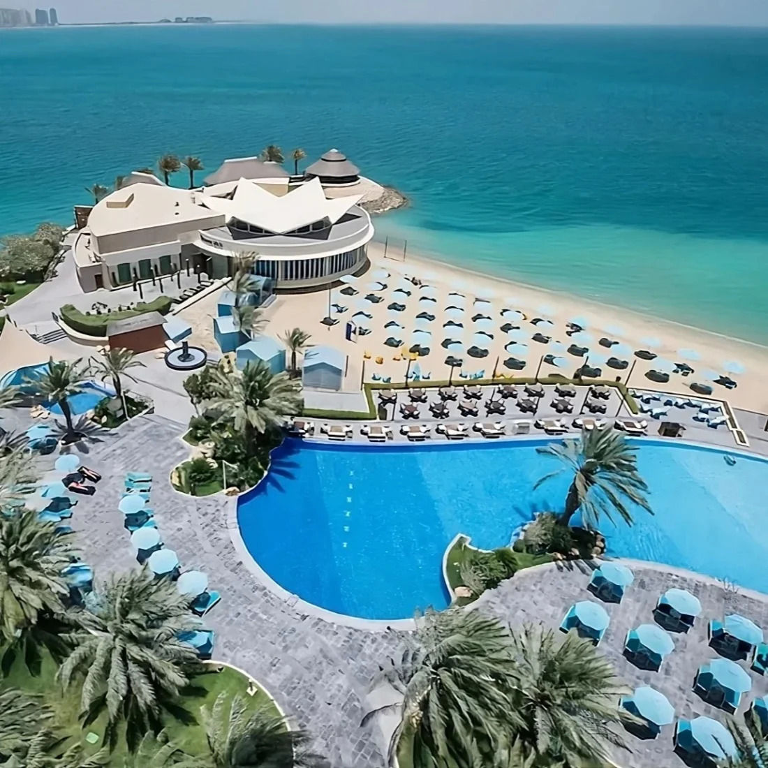 Hilton Doha Review: Luxe Beachfront Resort in West Bay 10 doha hilton pool overhead